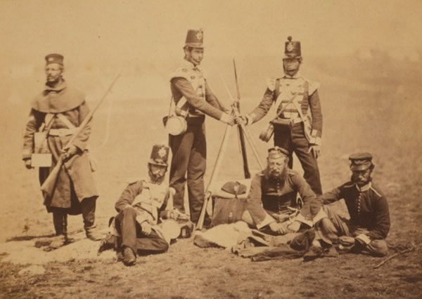 Private soldiers and officers of the 3rd Regiment (The Buffs) piling arms