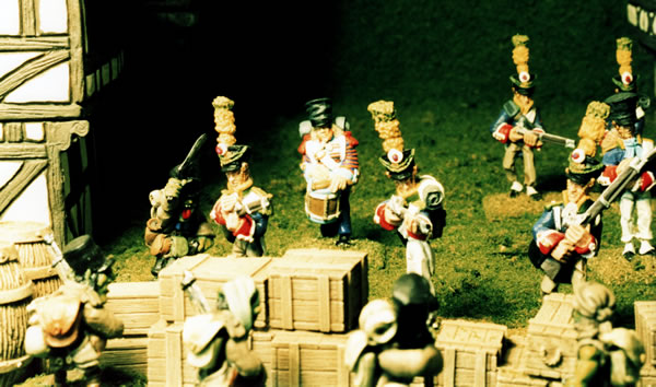 Elven Voltigeurs attack an Goblin Caçadores defending a village.